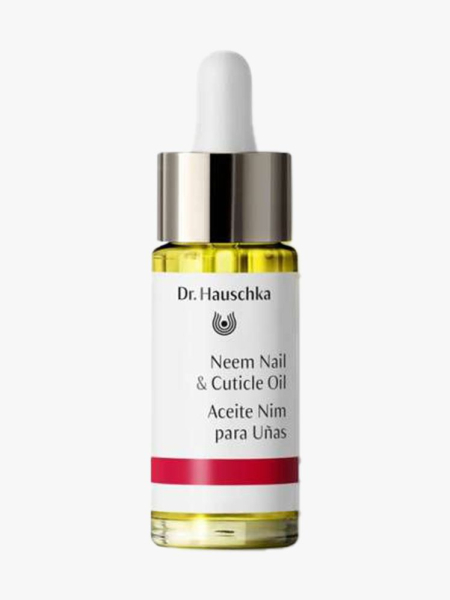 Gold and silver detailed cuticle oil bottle with white top and label. 