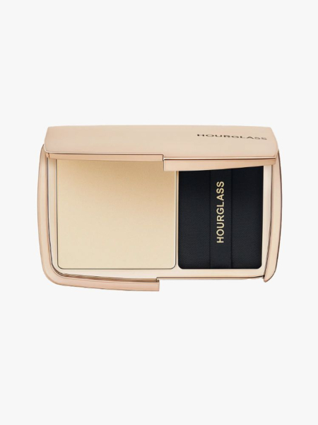 Hourglass Vanish Airbrush Pressed Powder gold compact of powder on light gray background